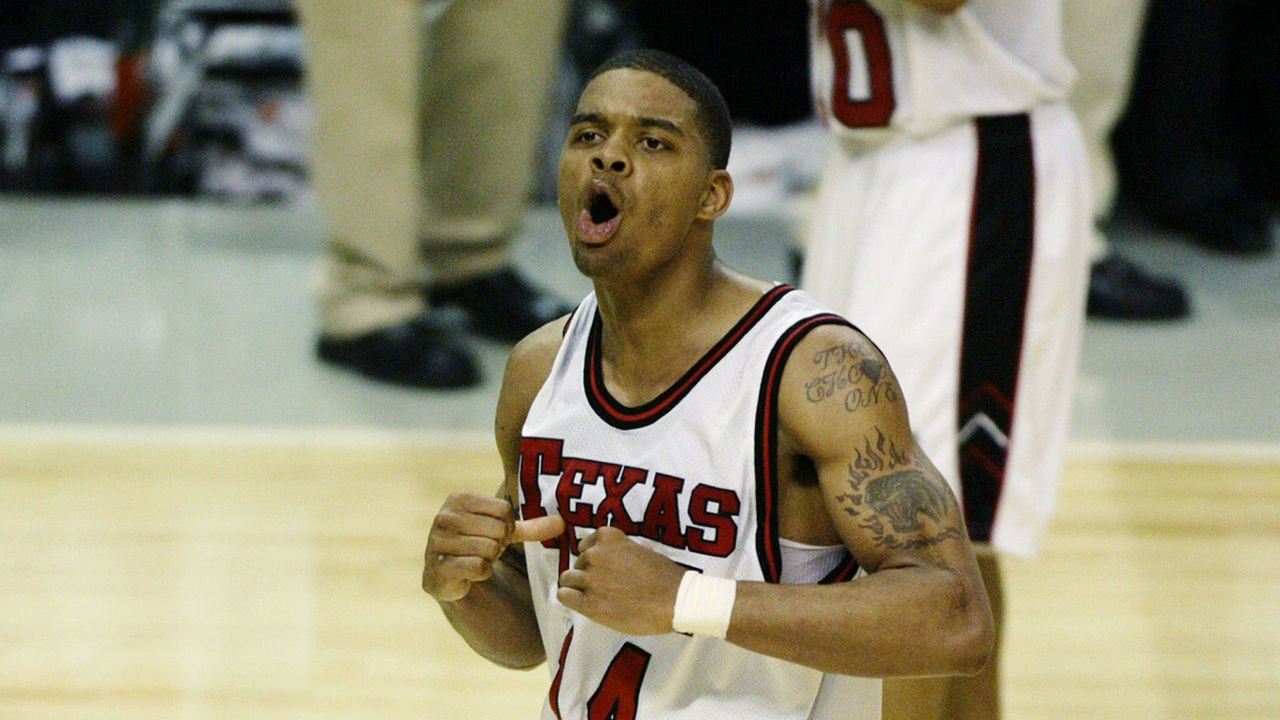 DALLAS - MARCH 13: Andre Emmett #14 of the Texas Tech University Red Raiders celebrates during the Big XII Championships against the Baylor University Bears at the American Airlines Center on March 13, 2003 in Dallas, Texas. Texas Tech defeated Baylor 68-66.