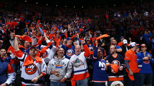 UNIONDALE, NEW YORK - APRIL 10: Fans celebrate during the game between the New York Islanders and the Pittsburgh Penguins in Game One of the Eastern Conference First Round during the 2019 NHL Stanley Cup Playoffs at NYCB Live's Nassau Coliseum on April 10, 2019 in Uniondale, New York. New York Islanders defeated the Pittsburgh Penguins 4-3 in overtime.