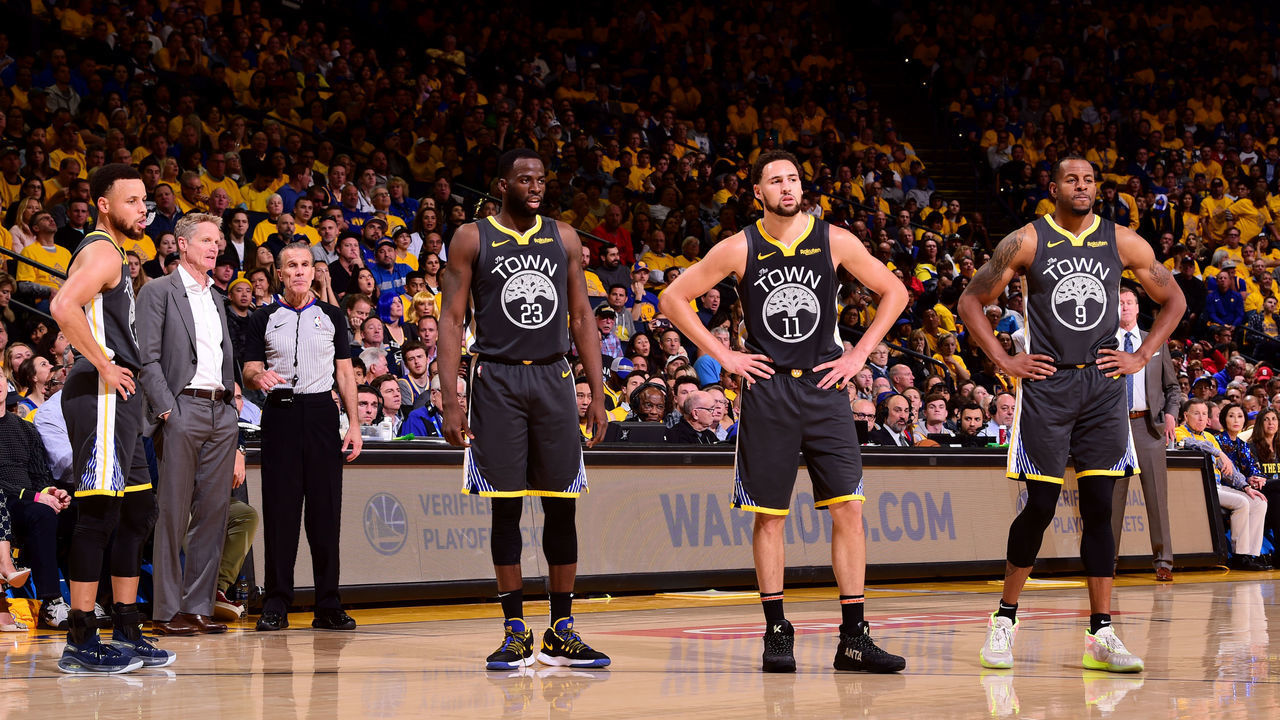 OAKLAND, CA - MAY 16: Stephen Curry #30, Draymond Green #23, Klay Thompson #11, and Andre Iguodala #9 look on during Game Two of the 2019 Western Conference Finals of the NBA Playoffs at the ORACLE Arena on May 16, 2019 in Oakland, California. Mandatory Copyright Notice: Copyright 2019 NBAE