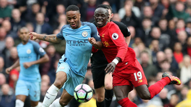 Manchester City's Raheem Sterling (left) and Liverpool's Sadio Mane battle for the ball during the Premier League match at the Etihad Stadium, Manchester.