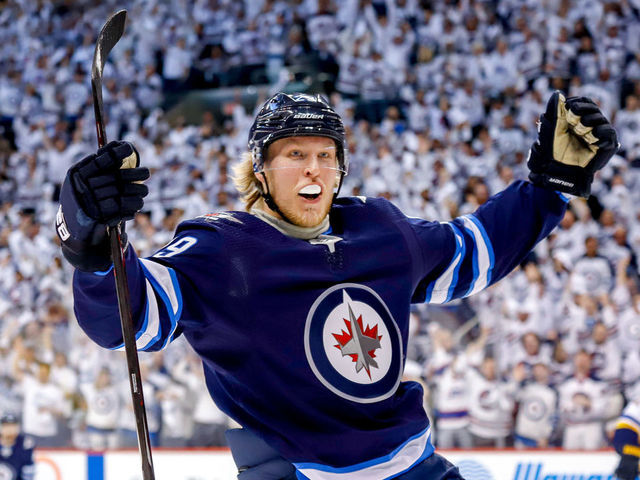 WINNIPEG, MB - APRIL 10: Patrik Laine #29 of the Winnipeg Jets celebrates after scoring a first period goal against the St. Louis Blues in Game One of the Western Conference First Round during the 2019 NHL Stanley Cup Playoffs at the Bell MTS Place on April 10, 2019 in Winnipeg, Manitoba, Canada.