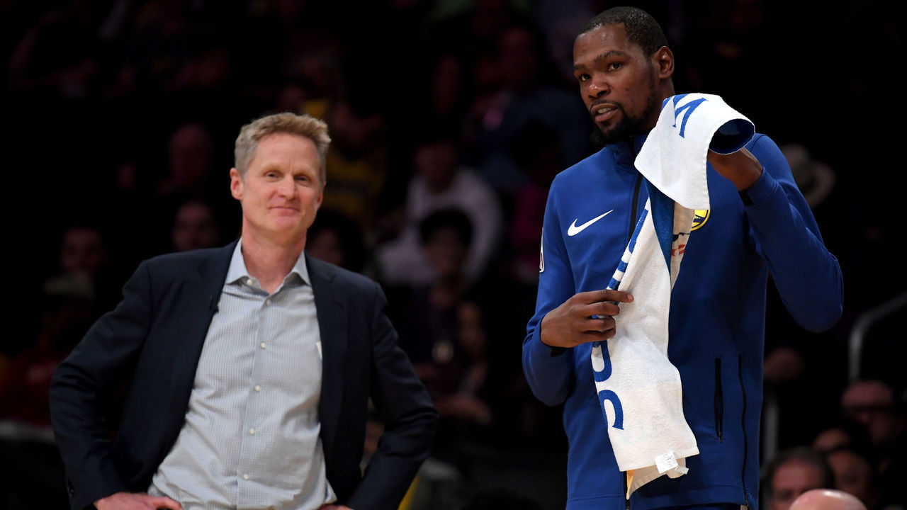 LOS ANGELES, CALIFORNIA - JANUARY 21: Kevin Durant #35 and Steve Kerr of the Golden State Warriors smile courtside during a 130-111 win over the Los Angeles Lakers at Staples Center on January 21, 2019 in Los Angeles, California.