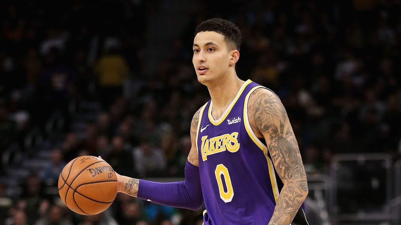 MILWAUKEE, WISCONSIN - MARCH 19: Kyle Kuzma #0 of the Los Angeles Lakers dribbles the ball in the third quarter against the Milwaukee Bucks at the Fiserv Forum on March 19, 2019 in Milwaukee, Wisconsin.