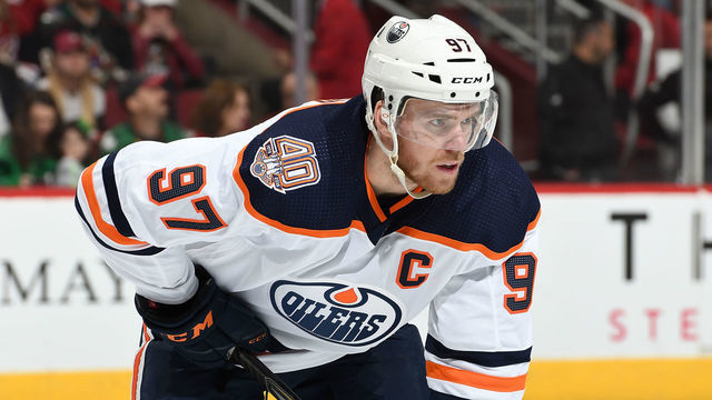 GLENDALE, AZ - MARCH 16: Connor McDavid #97 of the Edmonton Oilers gets ready during a faceoff against the Arizona Coyotes at Gila River Arena on March 16, 2019 in Glendale, Arizona.