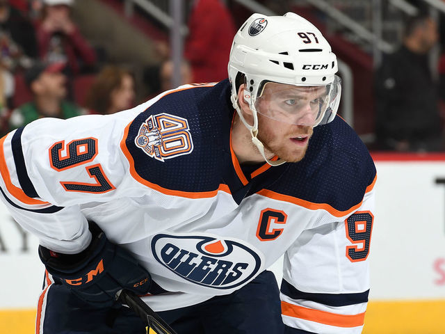 GLENDALE, AZ - MARCH 16: Connor McDavid #97 of the Edmonton Oilers gets ready during a faceoff against the Arizona Coyotes at Gila River Arena on March 16, 2019 in Glendale, Arizona.