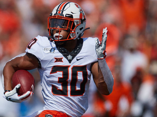 TULSA, OK - SEPTEMBER 14: Oklahoma State Cowboys RB Chuba Hubbard (30) looks back towards the defense on a long TD run during a college football game between the Tulsa Golden Hurricane and the Oklahoma State Cowboys on September 14, 2019, at H.A. Chapman Stadium in Tulsa, OK.