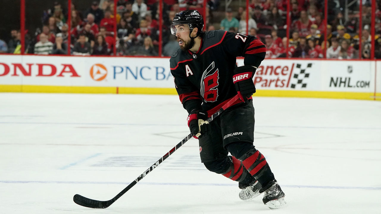 RALEIGH, NC - MAY 16: Justin Faulk #27 of the Carolina Hurricanes controls the puck on the ice in Game Four of the Eastern Conference Third Round against the Boston Bruins during the 2019 NHL Stanley Cup Playoffs on May 16, 2019 at PNC Arena in Raleigh, North Carolina.