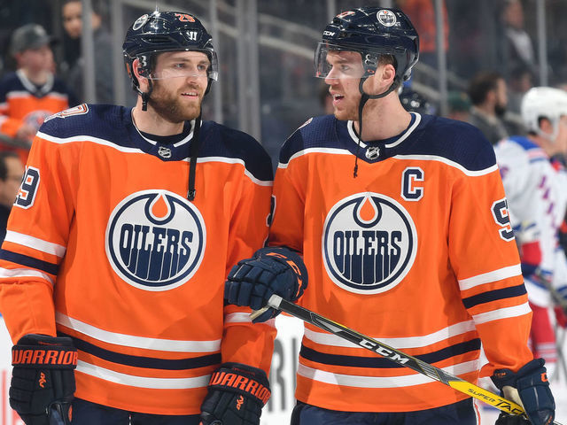 EDMONTON, AB - MARCH 11: Connor McDavid #97 and Leon Draisaitl #29 of the Edmonton Oilers warm up prior to the game against the New York Rangers on March 11, 2019 at Rogers Place in Edmonton, Alberta, Canada.