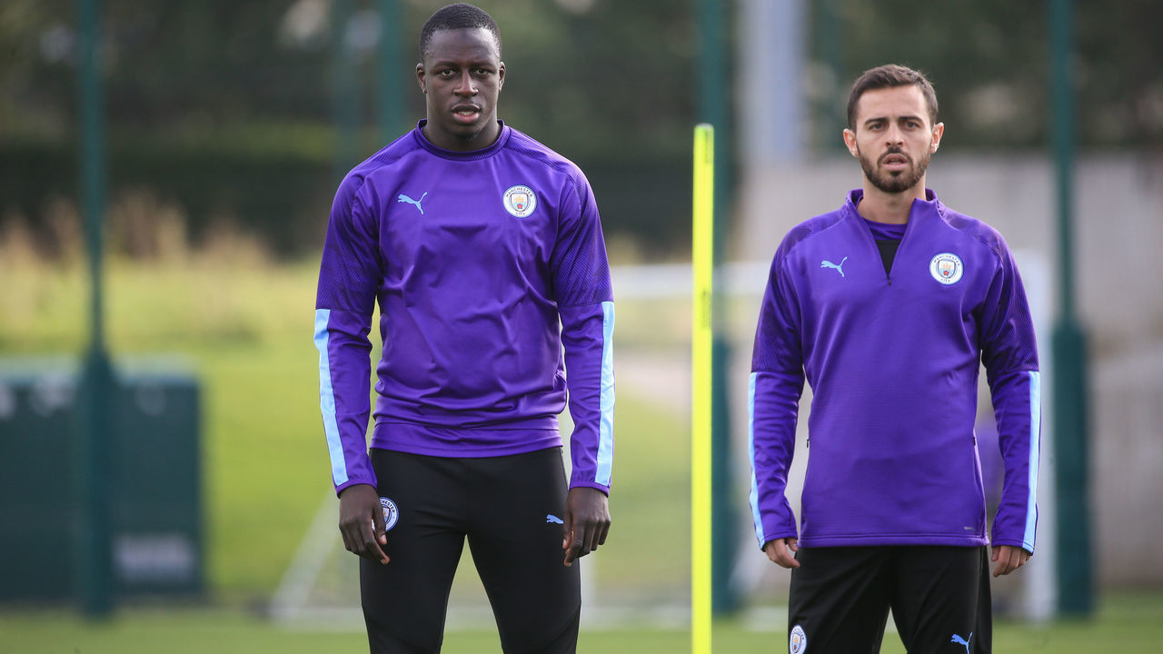 MANCHESTER, ENGLAND - SEPTEMBER 13: Manchester City's Benjamin Mendy and Bernardo Silva in action during training at Manchester City Football Academy on September 13, 2019 in Manchester, England.