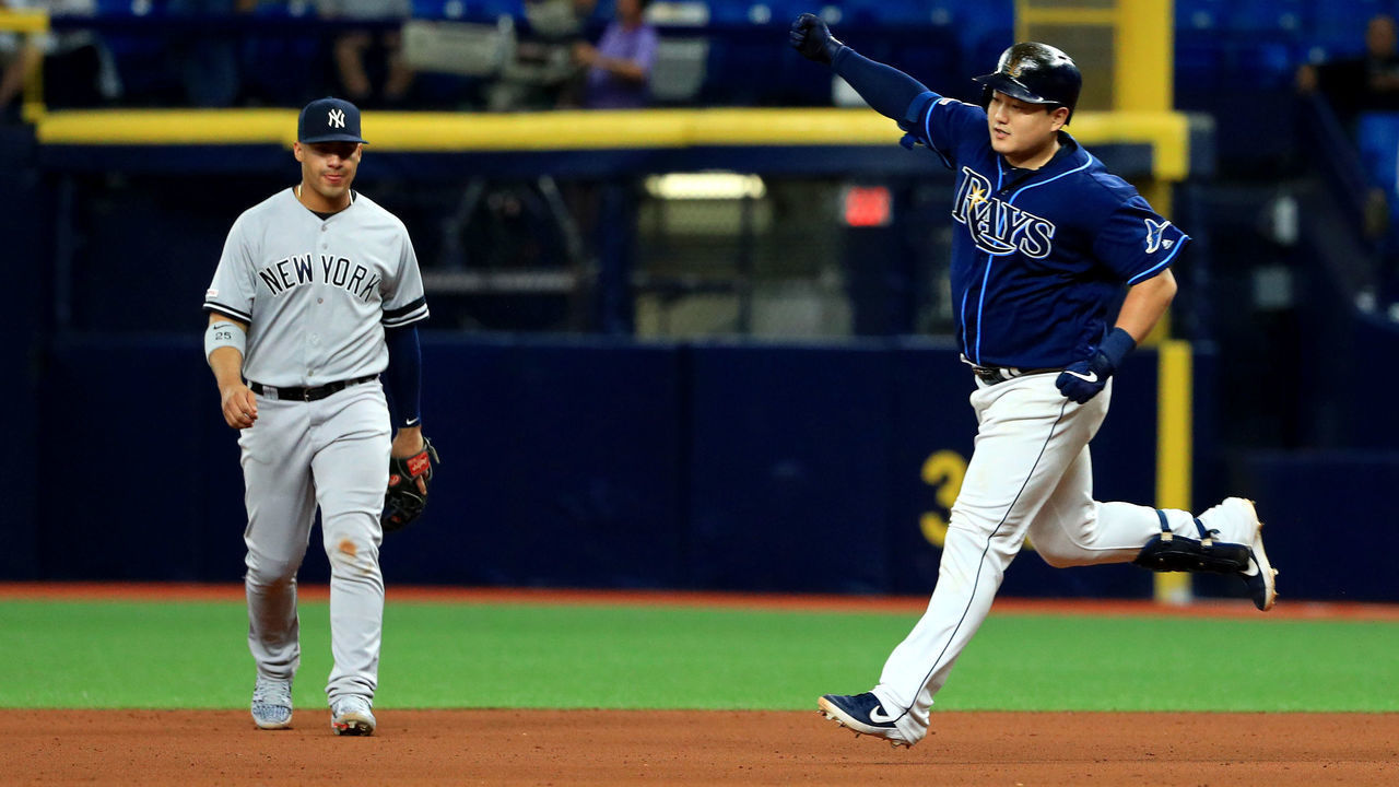 ST PETERSBURG, FLORIDA - SEPTEMBER 24: Ji-Man Choi #26 of the Tampa Bay Rays celebrates a walk off home run in the 12th inning during a game against the New York Yankees at Tropicana Field on September 24, 2019 in St Petersburg, Florida.