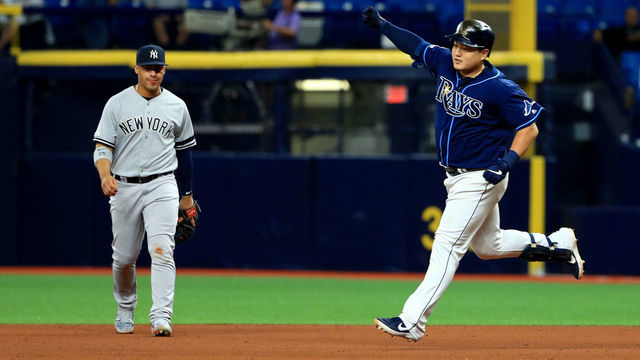 ST PETERSBURG, FLORIDA - SEPTEMBER 24: Ji-Man Choi #26 of the Tampa Bay Rays celebrates a walk off home run in the 12th inning during a game against the New York Yankees at Tropicana Field on September 24, 2019 in St Petersburg, Florida.