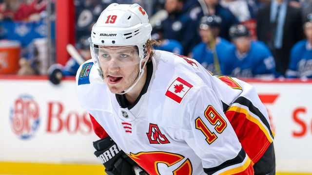 WINNIPEG, MB - MARCH 16: Matthew Tkachuk #19 of the Calgary Flames looks on during a first period face-off against the Winnipeg Jets at the Bell MTS Place on March 16, 2019 in Winnipeg, Manitoba, Canada.