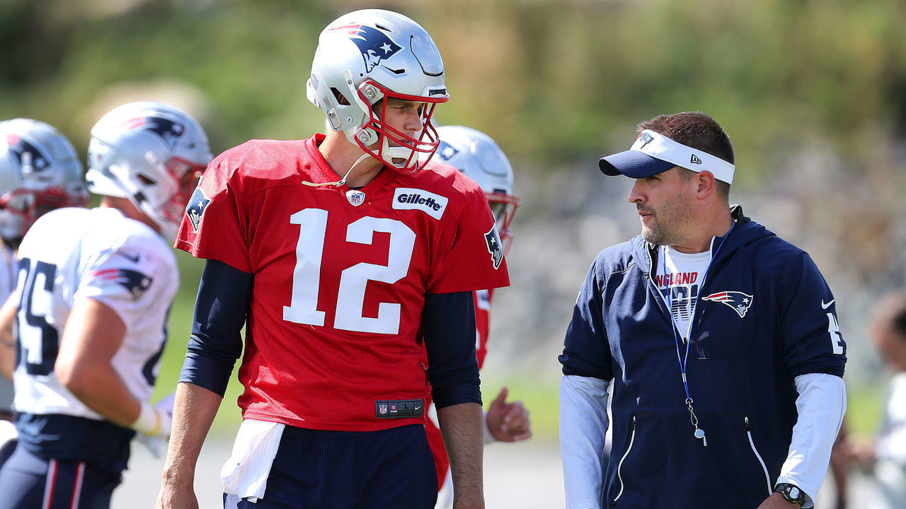 FOXBOROUGH, MA - SEPTEMBER 25: New England Patriots quarterback Tom Brady, left, and offensive coordinator Josh McDaniels chat during warmups at New England Patriots practice at Gillette Stadium in Foxborough, MA on Sep. 25, 2019.