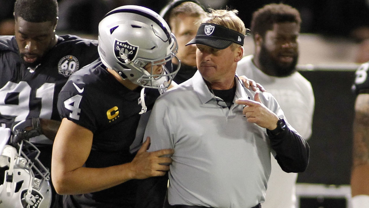 OAKLAND, CA - SEPTEMBER 09: Oakland Raiders Quarterback Derek Carr (4) kids with Head coach Jon Gruden during the Monday Night Football Season Opener between the Denver Broncos and the Oakland Raiders on Sept. 9, 2019 at RingCentral Coliseum in Oakland, CA.