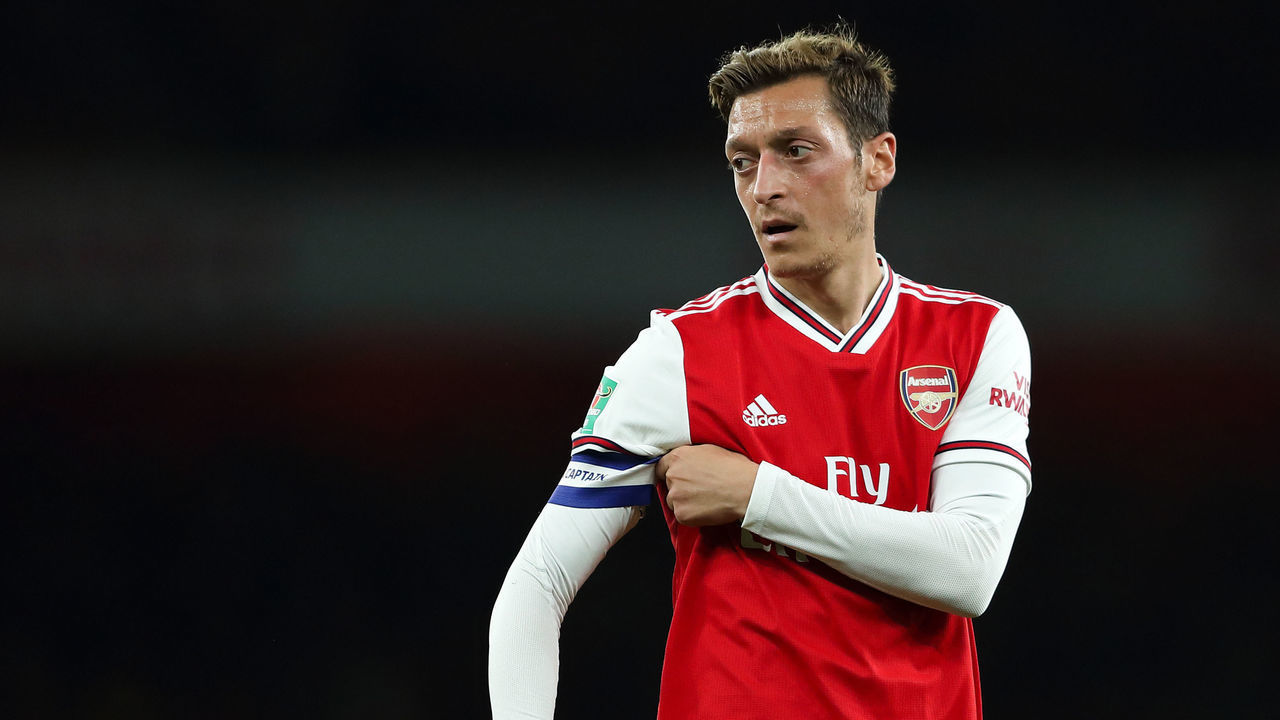 LONDON, ENGLAND - SEPTEMBER 24: Mesut Ozil of Arsenal pulling at his captain's armband during the Carabao Cup Third Round match between Arsenal and Nottingham Forest at Emirates Stadium on September 24, 2019 in London, England.