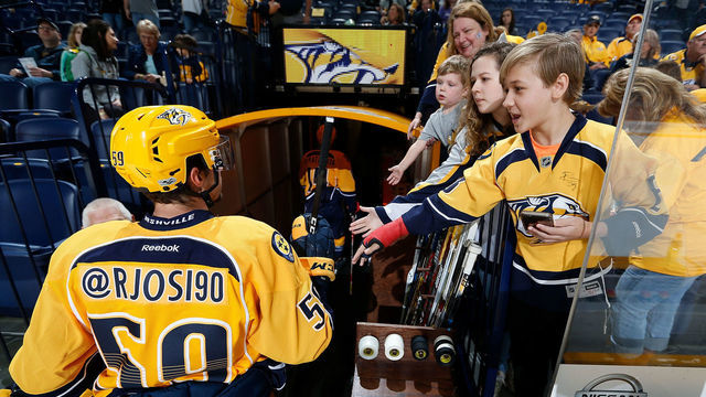 NASHVILLE, TN - APRIL 4: Roman Josi #59 of the Nashville Predators taps hands with fans wearing his Twitter handle during warmups for Social Media Night prior to an NHL game against the New York Islanders at Bridgestone Arena on April 4, 2017 in Nashville, Tennessee.
