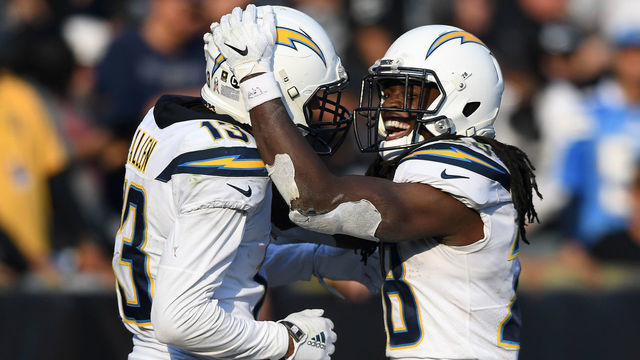 OAKLAND, CA - NOVEMBER 11: Melvin Gordon #28 of the Los Angeles Chargers celebrates after a 66-yard touchdown against the Oakland Raiders during their NFL game at Oakland-Alameda County Coliseum on November 11, 2018 in Oakland, California.