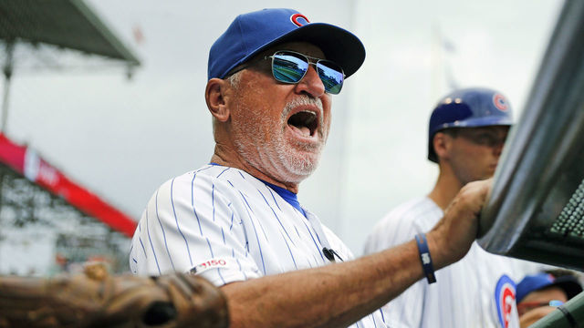 CHICAGO, ILLINOIS - SEPTEMBER 21: Manager Joe Maddon #70 of the Chicago Cubs stands in the dugout during the game against the St. Louis Cardinals at Wrigley Field on September 21, 2019 in Chicago, Illinois.