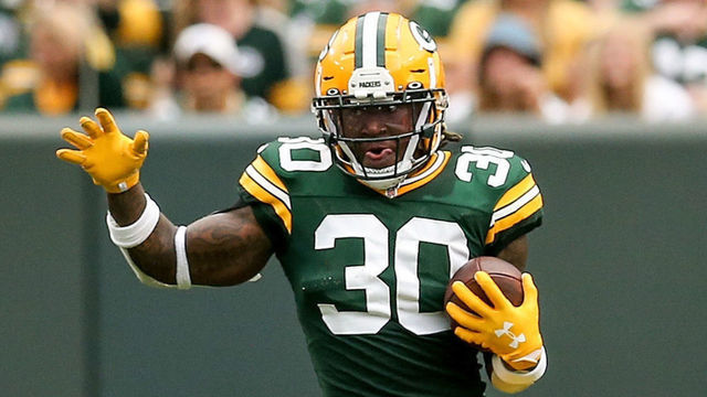 GREEN BAY, WISCONSIN - SEPTEMBER 15: Jamaal Williams #30 of the Green Bay Packers runs with the ball in the second quarter against the Minnesota Vikings at Lambeau Field on September 15, 2019 in Green Bay, Wisconsin.