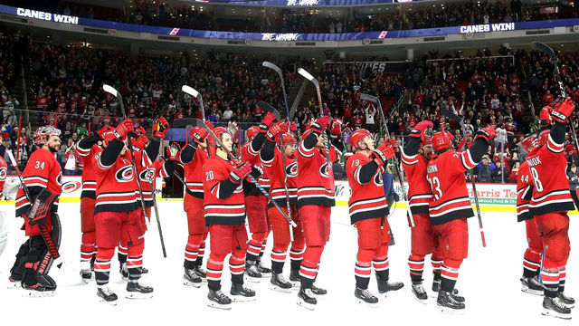 RALEIGH, NC - FEBRUARY 16: Members of the Carolina Hurricanes celebrate a victory over the Dallas Stars as they participate in a Storm Surge Celebratiion following an NHL game on February 16, 2019 at PNC Arena in Raleigh, North Carolina.