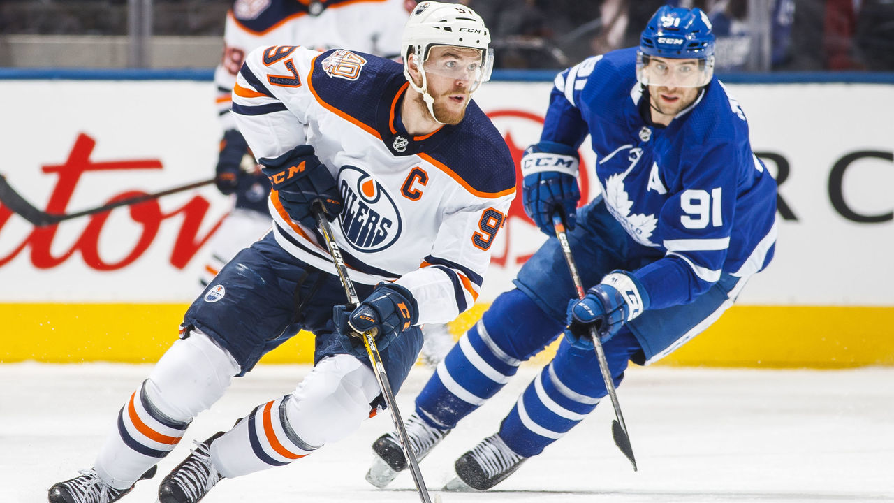 TORONTO, ON - FEBRUARY 27: Connor McDavid #97 of the Edmonton Oilers skates against John Tavares #91 of the Toronto Maple Leafs during the first period at the Scotiabank Arena on February 27, 2019 in Toronto, Ontario, Canada.