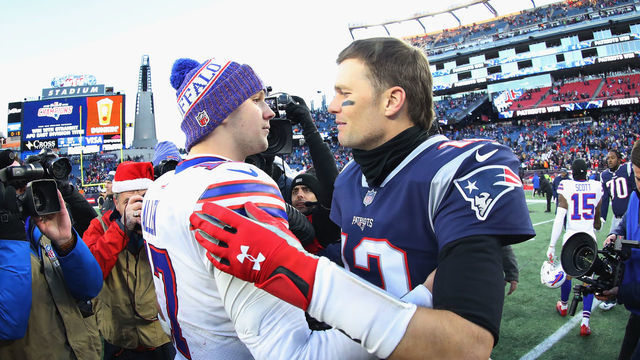 FOXBOROUGH, MA - DECEMBER 23: Josh Allen #17 of the Buffalo Bills and Tom Brady #12 of the New England Patriots meet on the field after the New England Patriots defeated the Buffalo Bills 24-12 at Gillette Stadium on December 23, 2018 in Foxborough, Massachusetts.