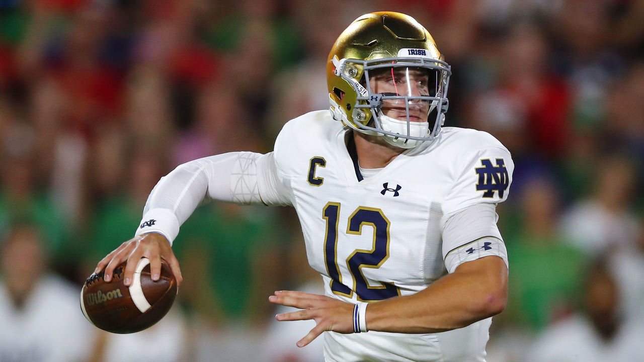ATHENS, GA - SEPTEMBER 21: Notre Dame Fighting Irish quarterback Ian Book (12) rolls out to pass during the first half of the Notre Dame Fighting Irish v Georgia Bulldogs game on September 21, 2019 at Sanford Stadium in Athens, GA.