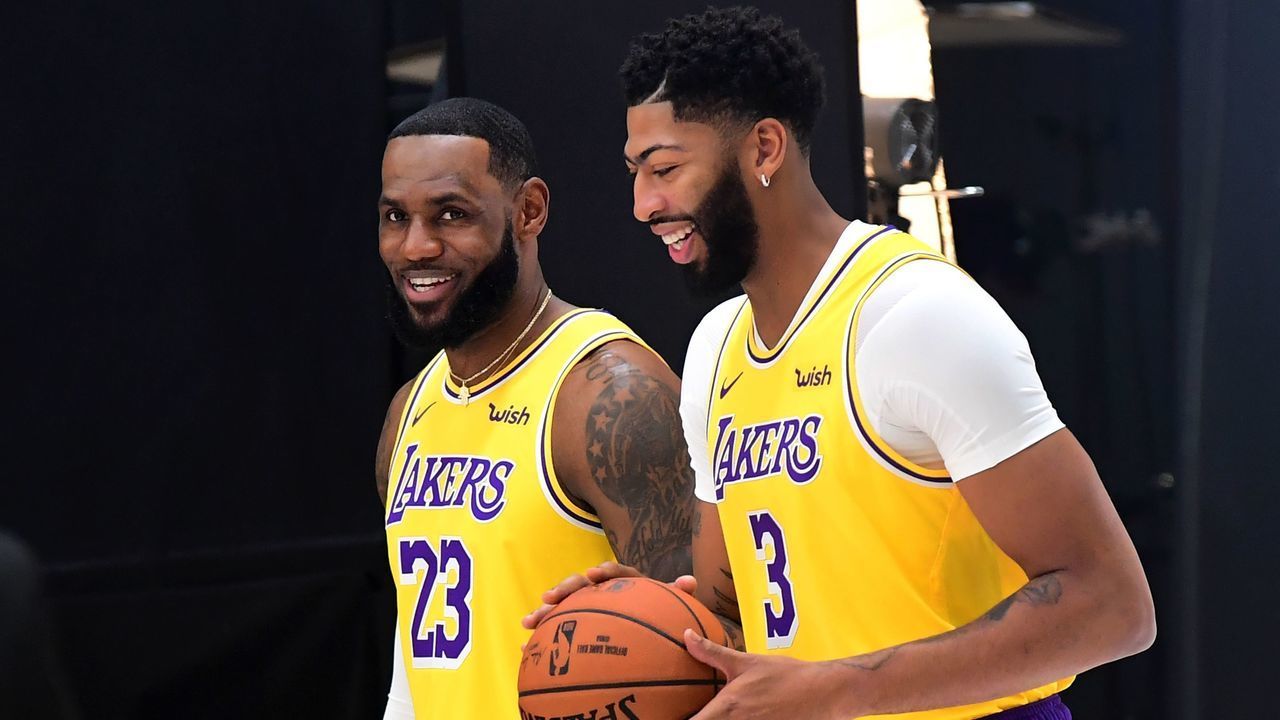LeBron James (L) and Anthony Davis of the Los Angeles Lakers arrive for a photo shoot during Lakers Media day in El Segundo, California on September 27, 2019.