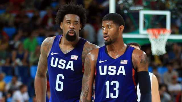 RIO DE JANEIRO, BRAZIL - AUGUST 21: DeAndre Jordan #6 and Paul George #13 of the USA talk during the Men's Gold medal game between Serbia and the USA on Day 16 of the Rio 2016 Olympic Games at Carioca Arena 1 on August 21, 2016 in Rio de Janerio, Brazil.
