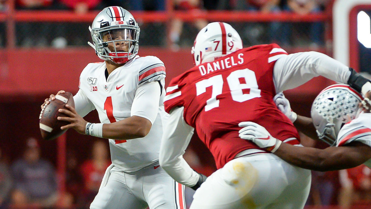 LINCOLN, NE - SEPTEMBER 28: Quarterback Justin Fields #1 of the Ohio State Buckeyes passes ahead of the rush from defensive lineman Darrion Daniels #79 of the Nebraska Cornhuskers at Memorial Stadium on September 28, 2019 in Lincoln, Nebraska.