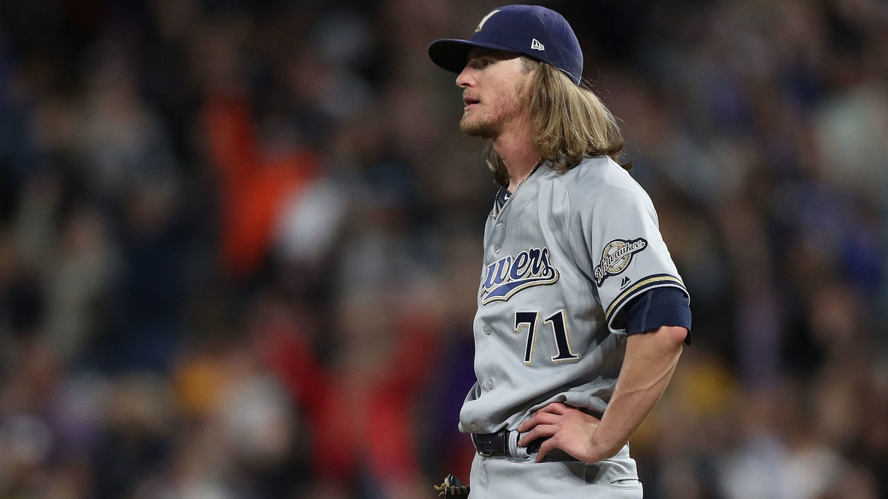 DENVER, COLORADO - SEPTEMBER 28: Pitcher Josh Hader #71 of the Milwaukee Brewers gives up a home run to Sam Hilliard in the ninth inning against the Colorado Rockies at Coors Field on September 28, 2019 in Denver, Colorado.
