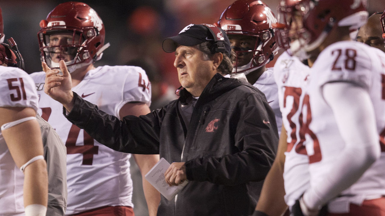 SALT LAKE CITY, UT - SEPTEMBER 28 : Head coach Mike Leach of the Washington State Cougars talks with his team during a time out during their game against the Utah Utes at Rice-Eccles Stadium on September 28, 2019 in Salt Lake City, Utah.