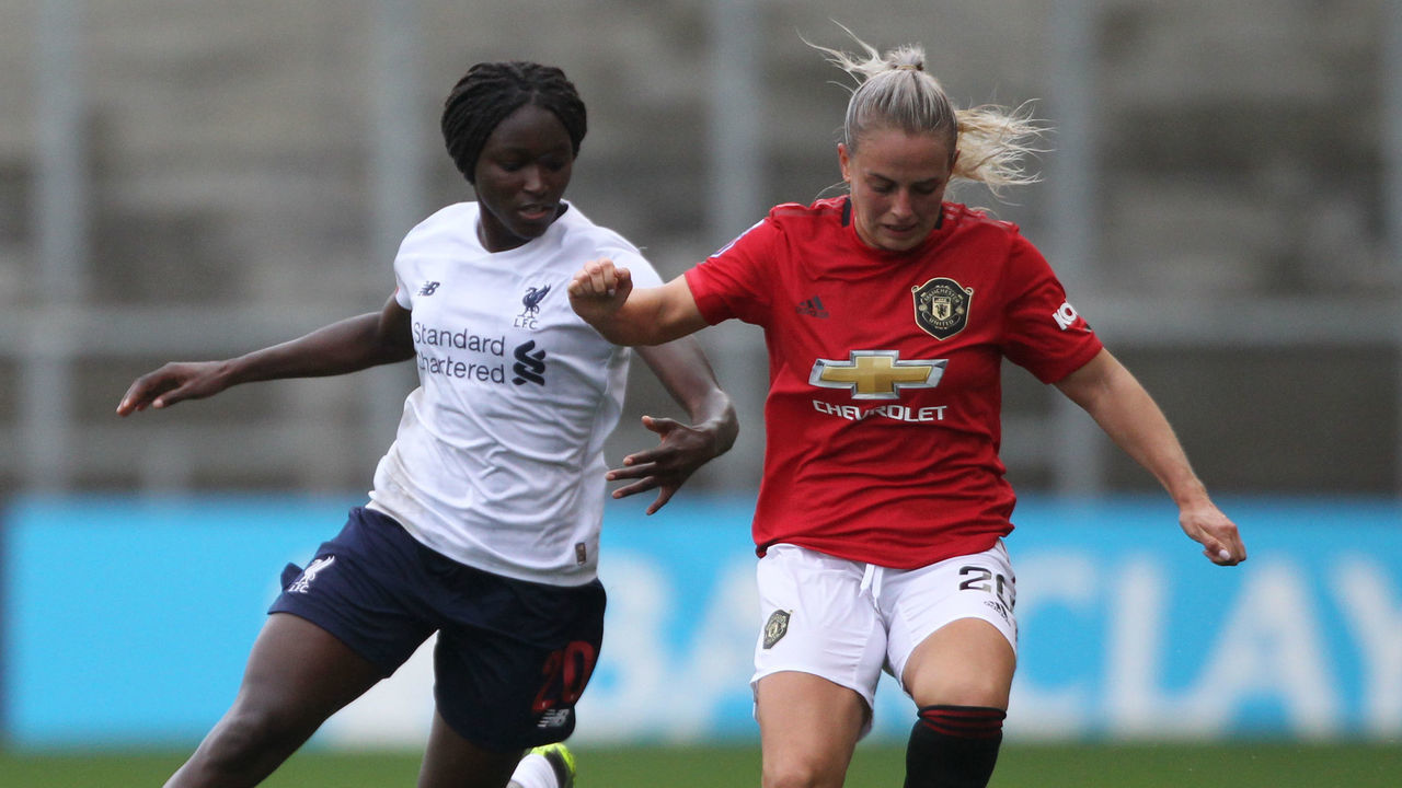 Manchester United's Kirsty Smith and Liverpool's Rinsola Babajide battle for the ball Manchester United v Liverpool - FA Women's Super League - Leigh Sports Village Stadium 28-09-2019 .