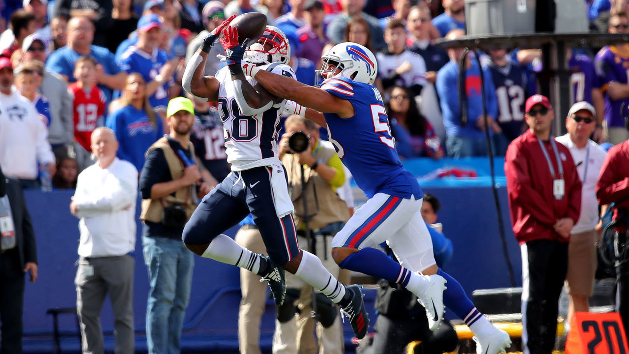 BUFFALO, NEW YORK - SEPTEMBER 29: James White #28 of the New England Patriots catches a 26 yard catch thrown by Tom Brady #12 against Matt Milano #58 of the Buffalo Bills during the first quarter in the game at New Era Field on September 29, 2019 in Buffalo, New York.