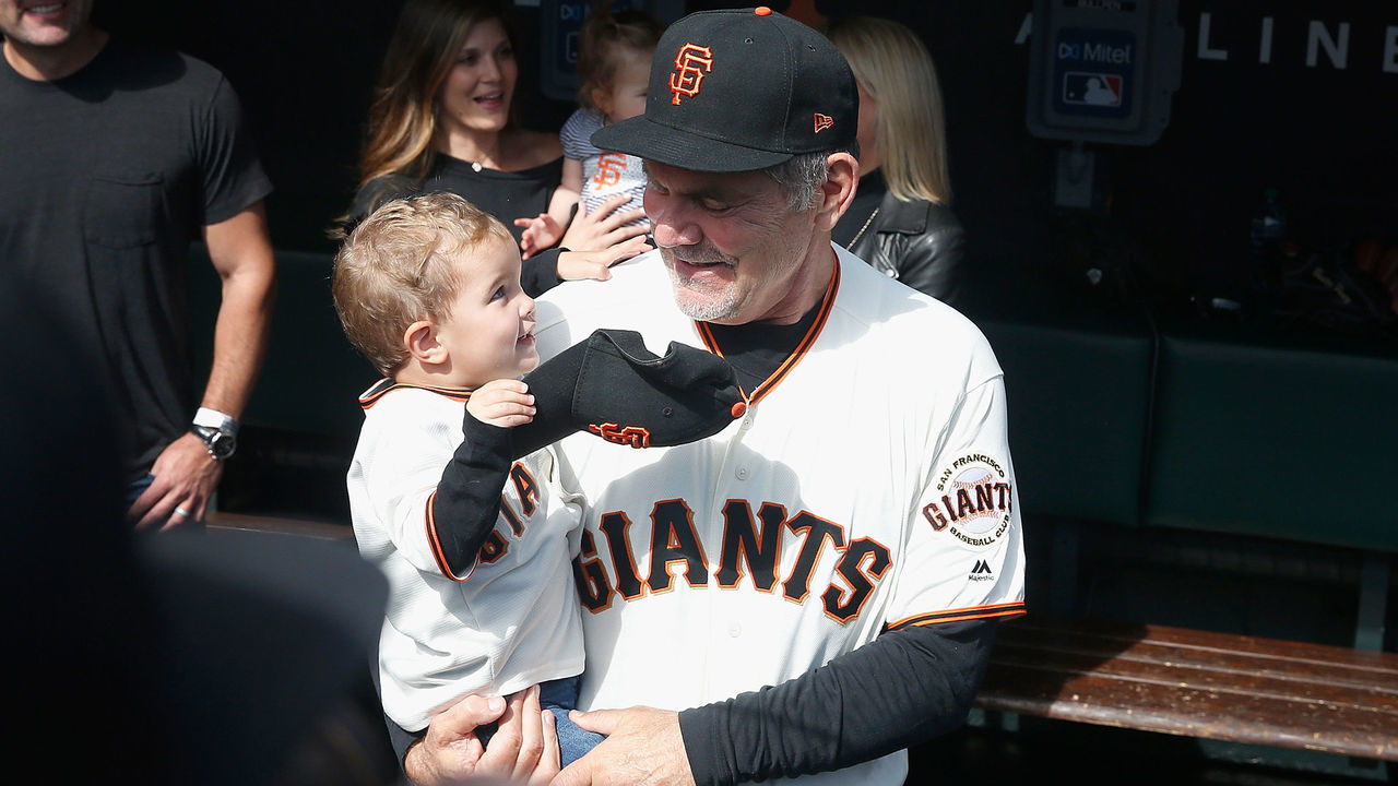 SAN FRANCISCO, CALIFORNIA - SEPTEMBER 29: Manager Bruce Bochy #15 of the San Francisco Giants stands in the dugout with his grandson before his final game as manager of the Giants, the game against the Los Angeles Dodgers at Oracle Park on September 29, 2019 in San Francisco, California.