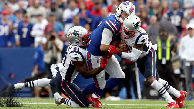 ORCHARD PARK, NEW YORK - SEPTEMBER 29: Duron Harmon #21 and Jonathan Jones #31 of the New England Patriots tackle Josh Allen #17 of the Buffalo Bills during the fourth quarter at New Era Field on September 29, 2019 in Orchard Park, New York. Allen left the game after this play.