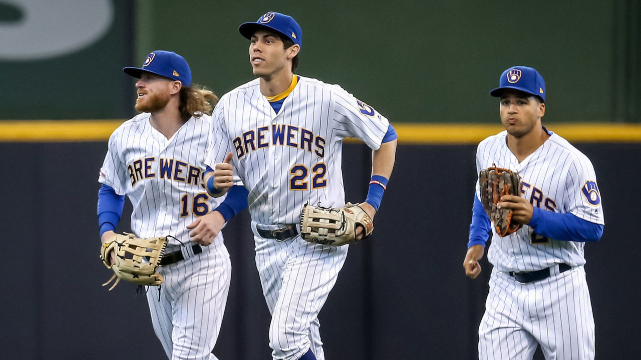 MILWAUKEE, WISCONSIN - SEPTEMBER 08: Ben Gamel #16, Trent Grisham #2, and Christian Yelich #22 of the Milwaukee Brewers celebrate after beating the Chicago Cubs 8-5 at Miller Park on September 08, 2019 in Milwaukee, Wisconsin.