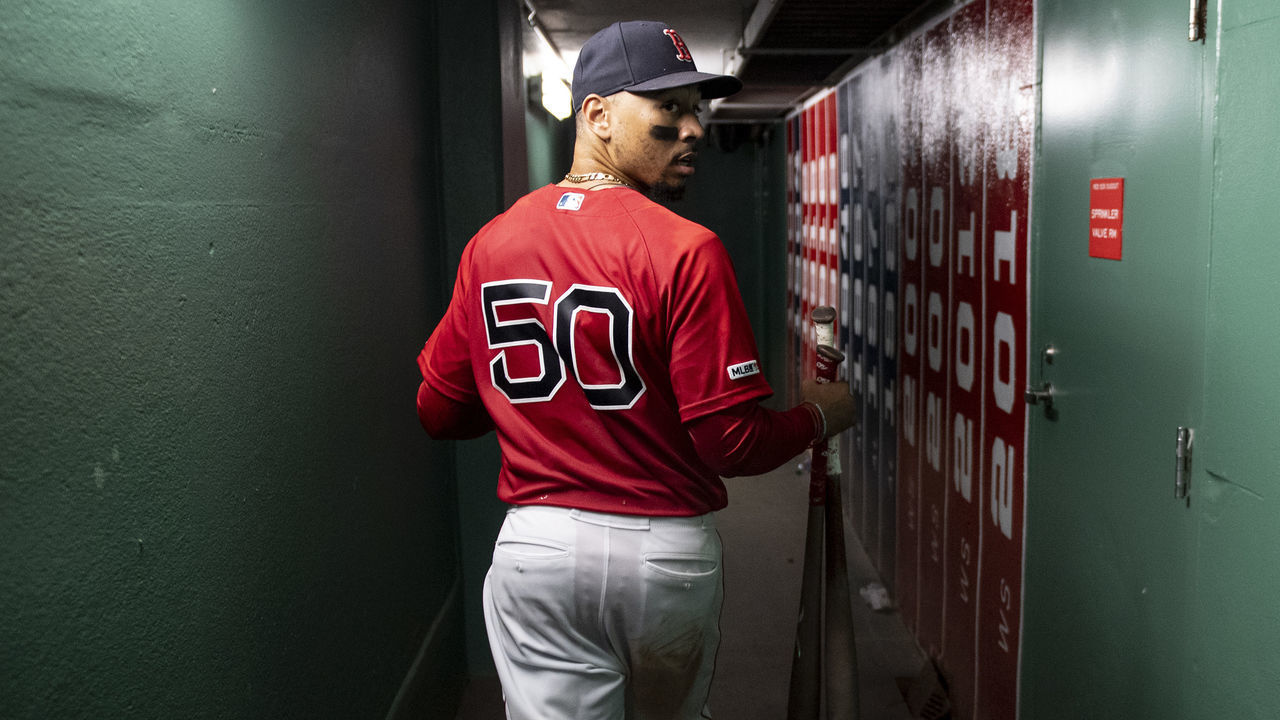 BOSTON, MA - SEPTEMBER 29: Mookie Betts #50 of the Boston Red Sox walks through the tunnel after scoring the game winning run on a walk-off single hit by Rafael Devers #11 during the ninth inning of a game against the Baltimore Orioles on September 29, 2019 at Fenway Park in Boston, Massachusetts.