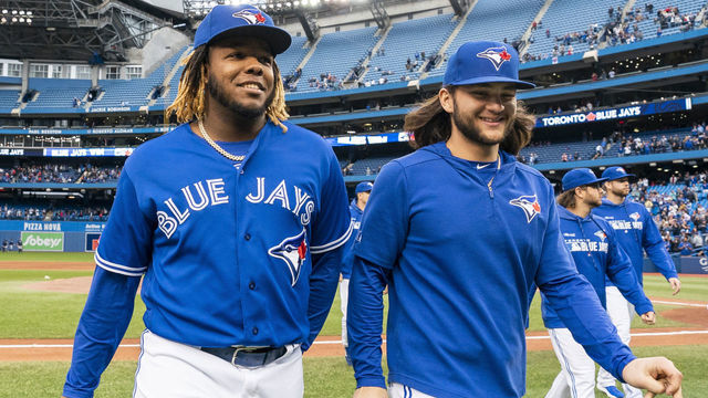 TORONTO, ONTARIO - SEPTEMBER 29: Vladimir Guerrero Jr. #27 and Bo Bichette #11 of the Toronto Blue Jays walk off the field after defeating the Tampa Bay Rays in the last game of the season in their MLB game at the Rogers Centre on September 29, 2019 in Toronto, Canada.
