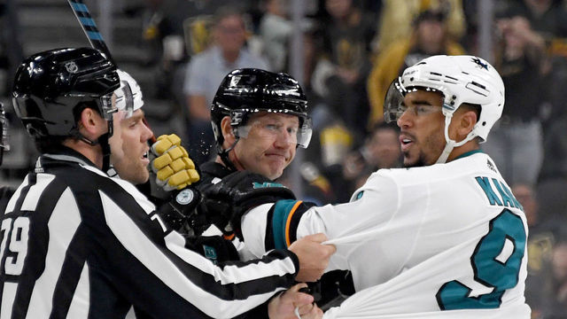 LAS VEGAS, NEVADA - SEPTEMBER 29: Evander Kane #9 of the San Jose Sharks shoves linesman Kiel Murchison in the third period of the Sharks' preseason game against the Vegas Golden Knights at T-Mobile Arena on September 29, 2019 in Las Vegas, Nevada. Kane received a game misconduct for an abuse of officials penalty. The Golden Knights defeated the Sharks 5-1.