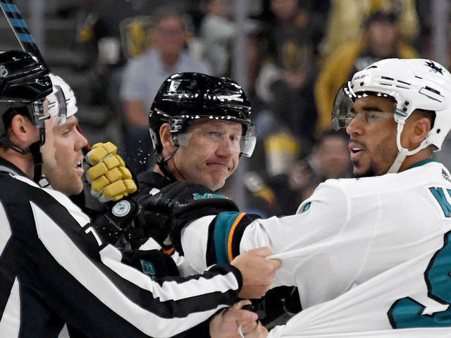 LAS VEGAS, NEVADA - SEPTEMBER 29: Evander Kane #9 of the San Jose Sharks shoves linesman Kiel Murchison in the third period of the Sharks' preseason game against the Vegas Golden Knights at T-Mobile Arena on September 29, 2019 in Las Vegas, Nevada. Kane received a game misconduct for an abuse of officials penalty. The Golden Knights defeated the Sharks 5-1.