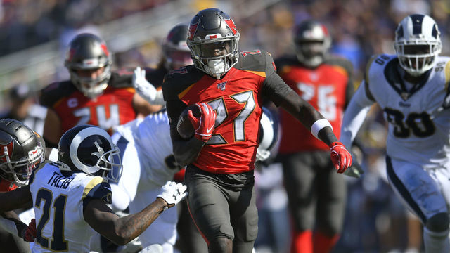 LOS ANGELES, CA - SEPTEMBER 29: Aqib Talib #21 of the Los Angeles Rams can not catch Ronald Jones #27 of the Tampa Bay Buccaneers in the second half at Los Angeles Memorial Coliseum on September 29, 2019 in Los Angeles, California. Tampa Bay won 55-40.
