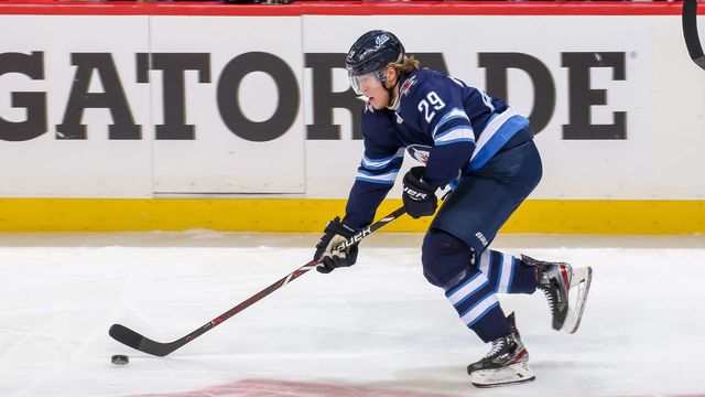 WINNIPEG, MB - APRIL 12: Patrik Laine #29 of the Winnipeg Jets plays the puck down the ice during third period action against the St. Louis Blues in Game Two of the Western Conference First Round during the 2019 NHL Stanley Cup Playoffs at the Bell MTS Place on April 12, 2019 in Winnipeg, Manitoba, Canada. The Blues defeated the Jets 4-3 to lead the series 2-0.