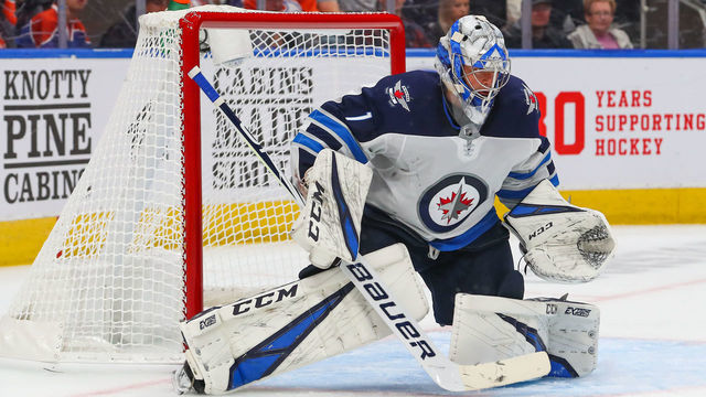 EDMONTON, AB - SEPTEMBER 16: Winnipeg Jets Goalie Eric Comrie (1) makes a butterfly save during the pre season Edmonton Oilers game versus the Winnipeg Jets on September 16, 2019 at Rogers Place in Edmonton, AB.