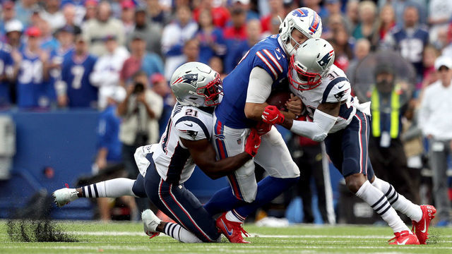 ORCHARD PARK, NEW YORK - SEPTEMBER 29: Duron Harmon #21 and Jonathan Jones #31 of the New England Patriots tackle Josh Allen #17 of the Buffalo Bills during the fourth quarter at New Era Field on September 29, 2019 in Orchard Park, New York. Allen left the game after this play.