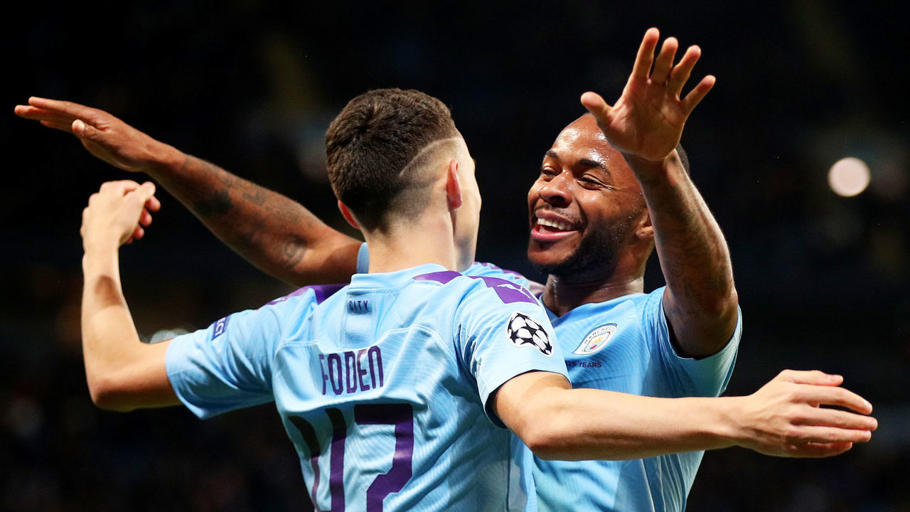 MANCHESTER, ENGLAND - OCTOBER 01: Phil Foden of Manchester City celebrates with teammate Raheem Sterling after scoring his team's second goal during the UEFA Champions League group C match between Manchester City and Dinamo Zagreb at Etihad Stadium on October 01, 2019 in Manchester, United Kingdom.