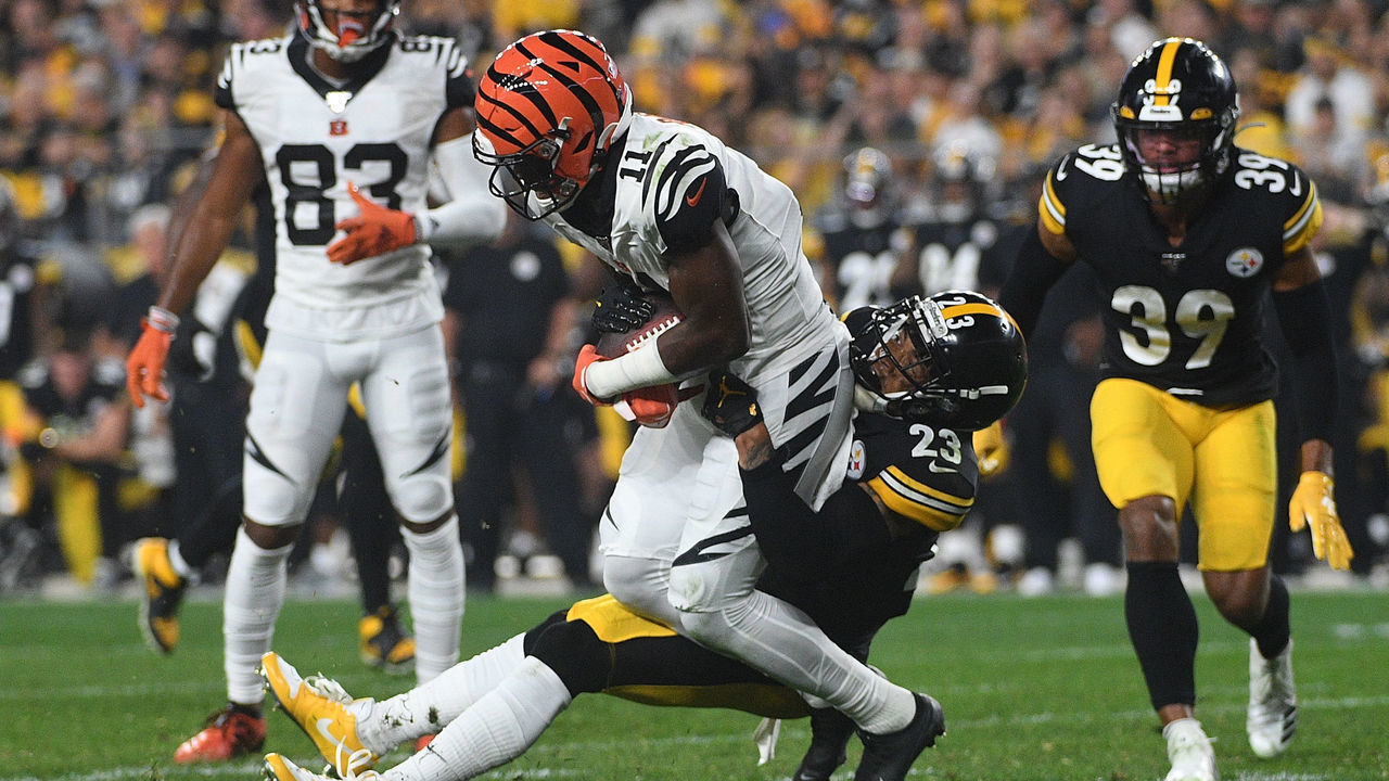PITTSBURGH, PA - SEPTEMBER 30: John Ross #11 of the Cincinnati Bengals is wrapped up for a tackle by Joe Haden #23 of the Pittsburgh Steelers in the second half during the game at Heinz Field on September 30, 2019 in Pittsburgh, Pennsylvania.