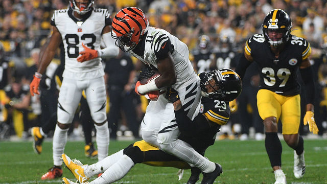 PITTSBURGH, PA - SEPTEMBER 30: John Ross #11 of the Cincinnati Bengals is wrapped up for a tackle by Joe Haden #23 of the Pittsburgh Steelers in the second half during the game at Heinz Field on September 30, 2019 in Pittsburgh, Pennsylvania.