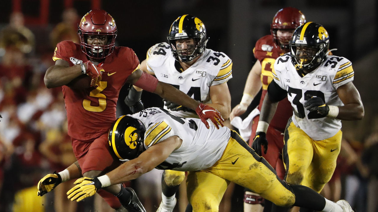AMES, IA - SEPTEMBER 14: Running back Kene Nwangwu #3 of the Iowa State Cyclones is tackled bye defensive end A.J. Epenesa #94 of the Iowa Hawkeyes as he rushed for yards in the second half of play at Jack Trice Stadium on September 14, 2019 in Ames, Iowa. The Iowa Hawkeyes won 18-17 over the Iowa State Cyclones.