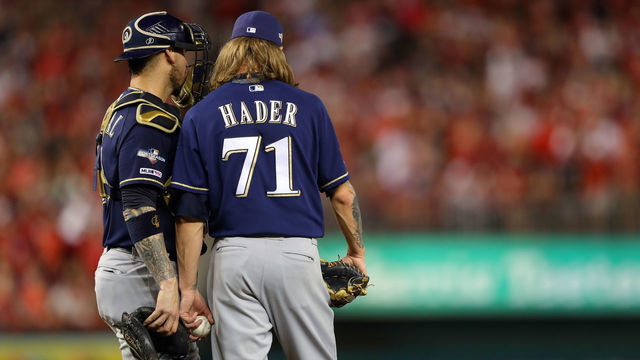 WASHINGTON, DC - OCTOBER 01: Josh Hader #71 and Yasmani Grandal #10 of the Milwaukee Brewers meet on the mound during the NL Wild Card game between the Milwaukee Brewers and the Washington Nationals at Nationals Park on Tuesday, October 1, 2019 in Washington, District of Columbia.